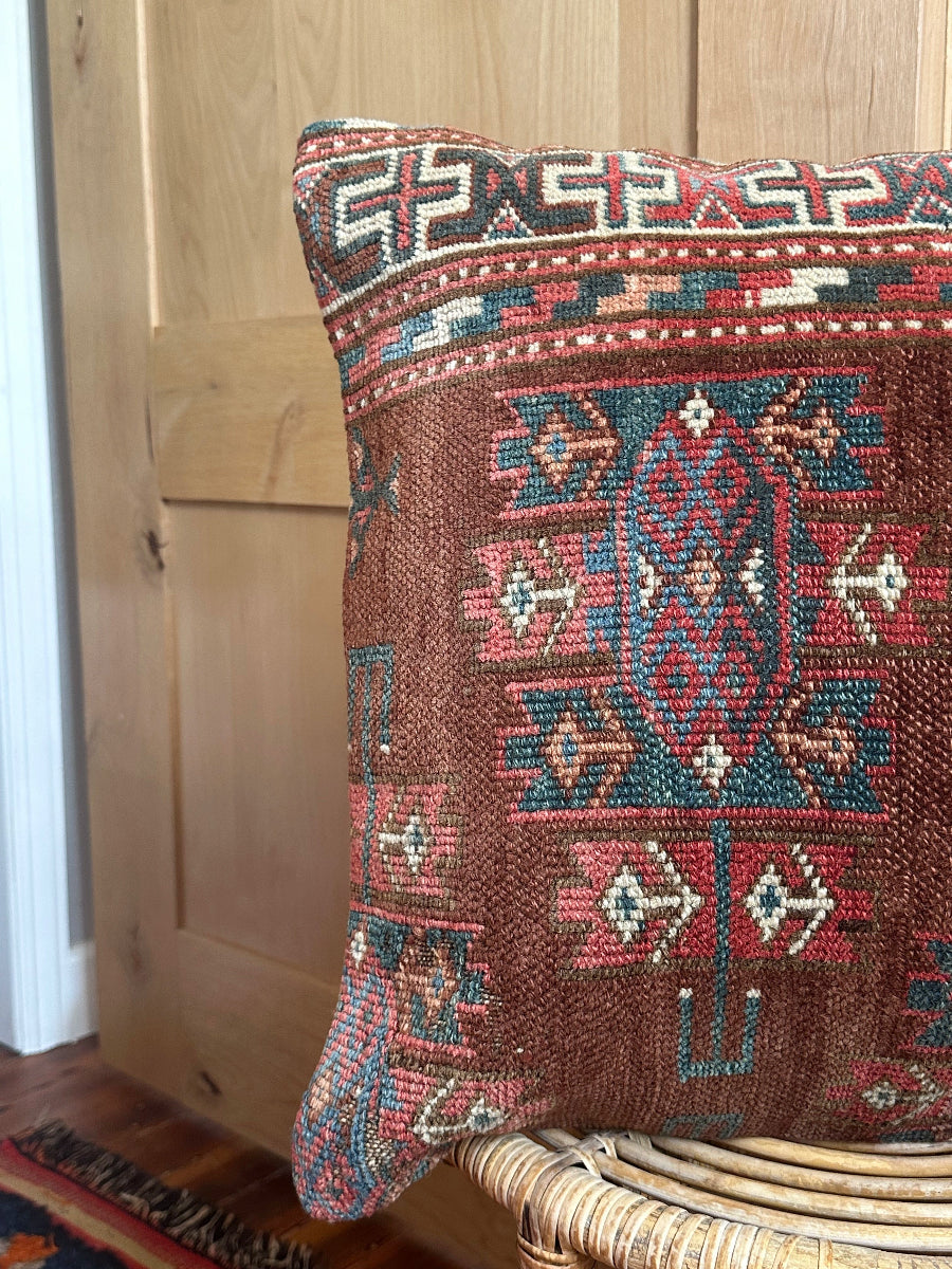 Handwoven red and green Turkish throw pillow, 20x20 inches, wool front with geometric design and pops of white, cotton backing—boho home decor.