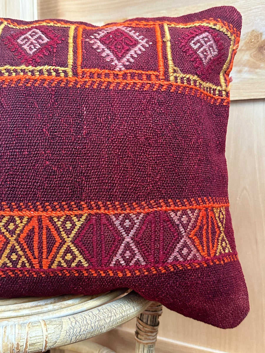 Handwoven red and orange Turkish lumbar pillow, 16x24 inches, wool front with geometric design and pops of white, cotton backing—boho home decor.