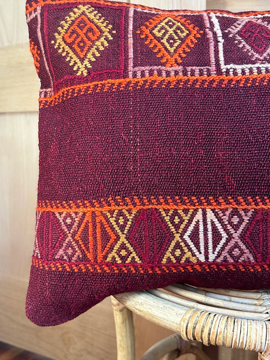 Handwoven red and orange Turkish lumbar pillow, 16x24 inches, wool front with geometric design and pops of white, cotton backing—boho home decor.