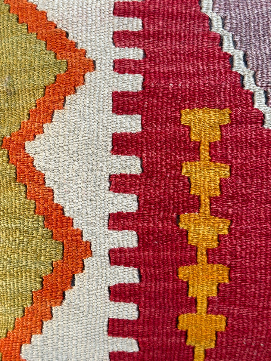 Handwoven colorful geometric Turkish throw pillow, 16x16 inches, wool front and cotton backing—boho home decor.