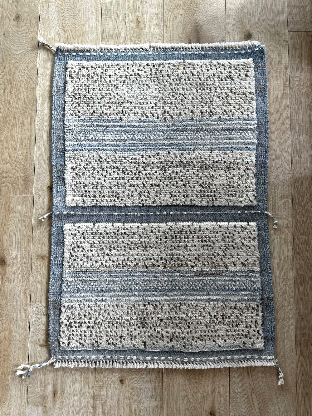 Hand-knotted mini Moroccan rug with a plush high-pile texture. Crafted from 100% wool, featuring a minimalist yet timeless design, perfect for modern, bohemian, or eclectic home décor.