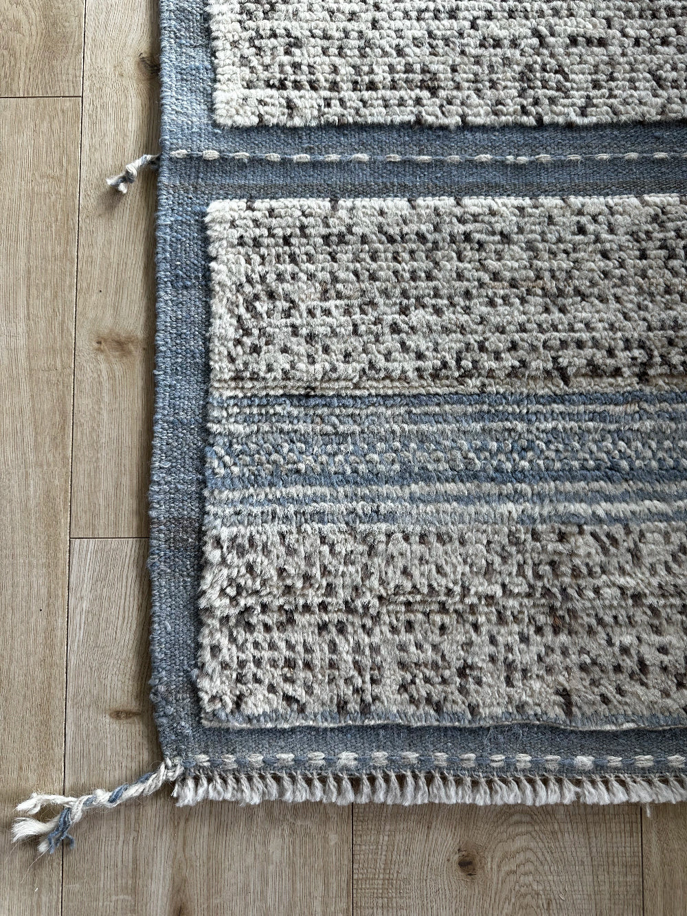 Hand-knotted mini Moroccan rug with a plush high-pile texture. Crafted from 100% wool, featuring a minimalist yet timeless design, perfect for modern, bohemian, or eclectic home décor.