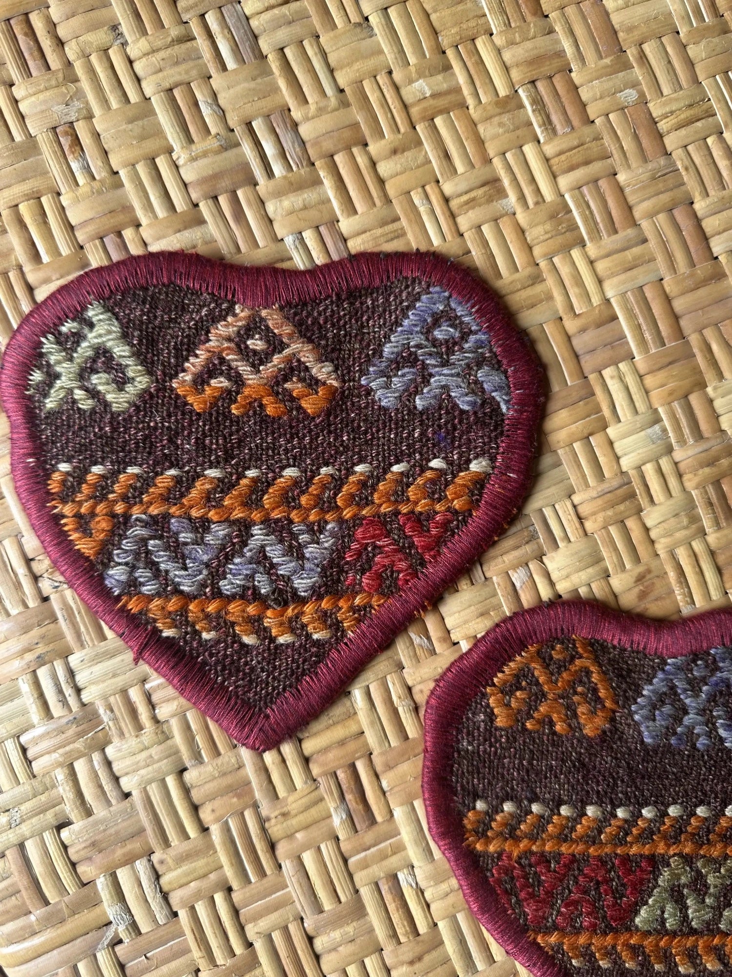 Unique 6.5 by 5.5 inch Turkish fabric coasters in the shape of a heart, upcycled from old turkish rugs and pillow scraps