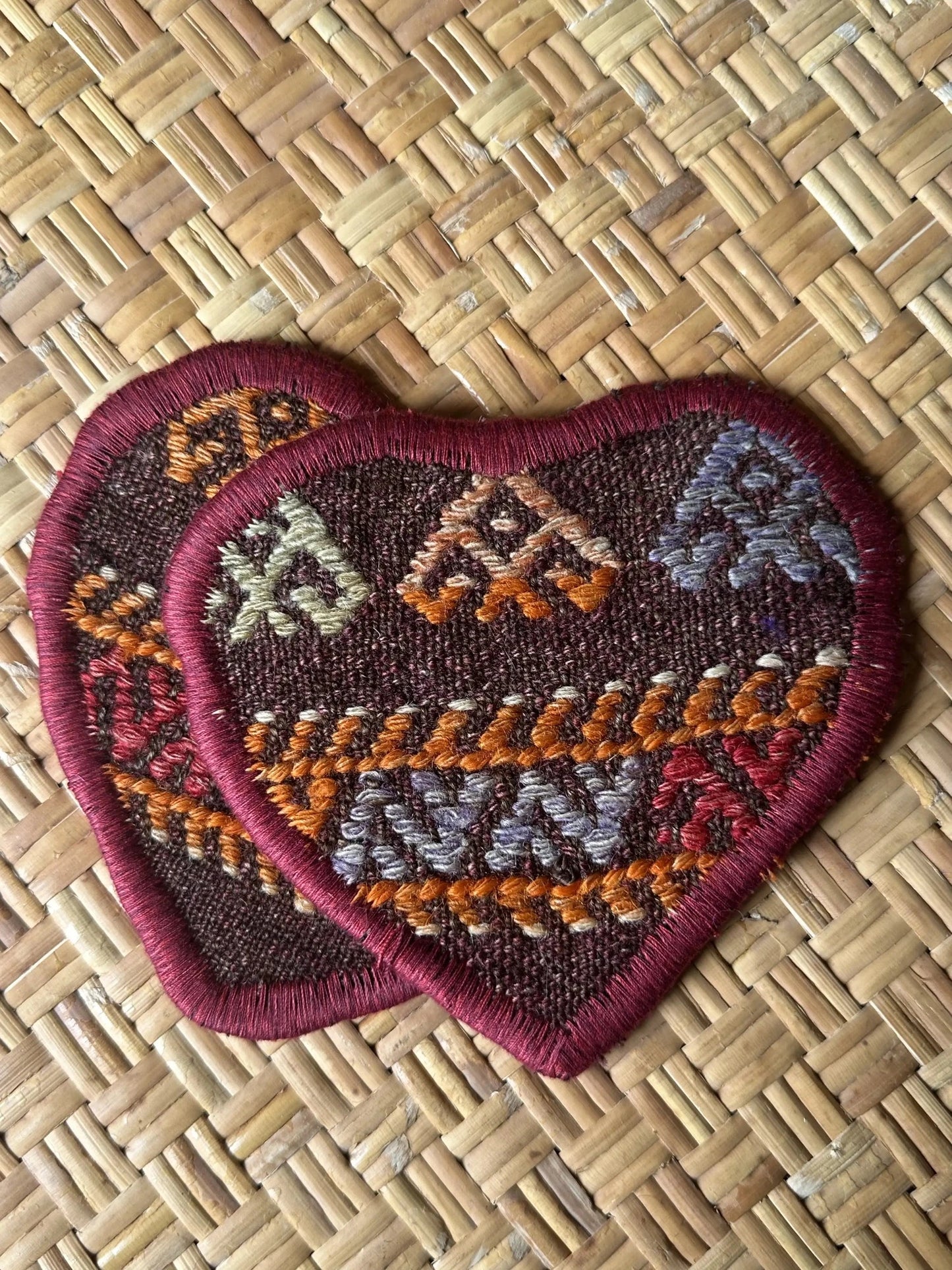 Unique 6.5 by 5.5 inch Turkish fabric coasters in the shape of a heart, upcycled from old turkish rugs and pillow scraps