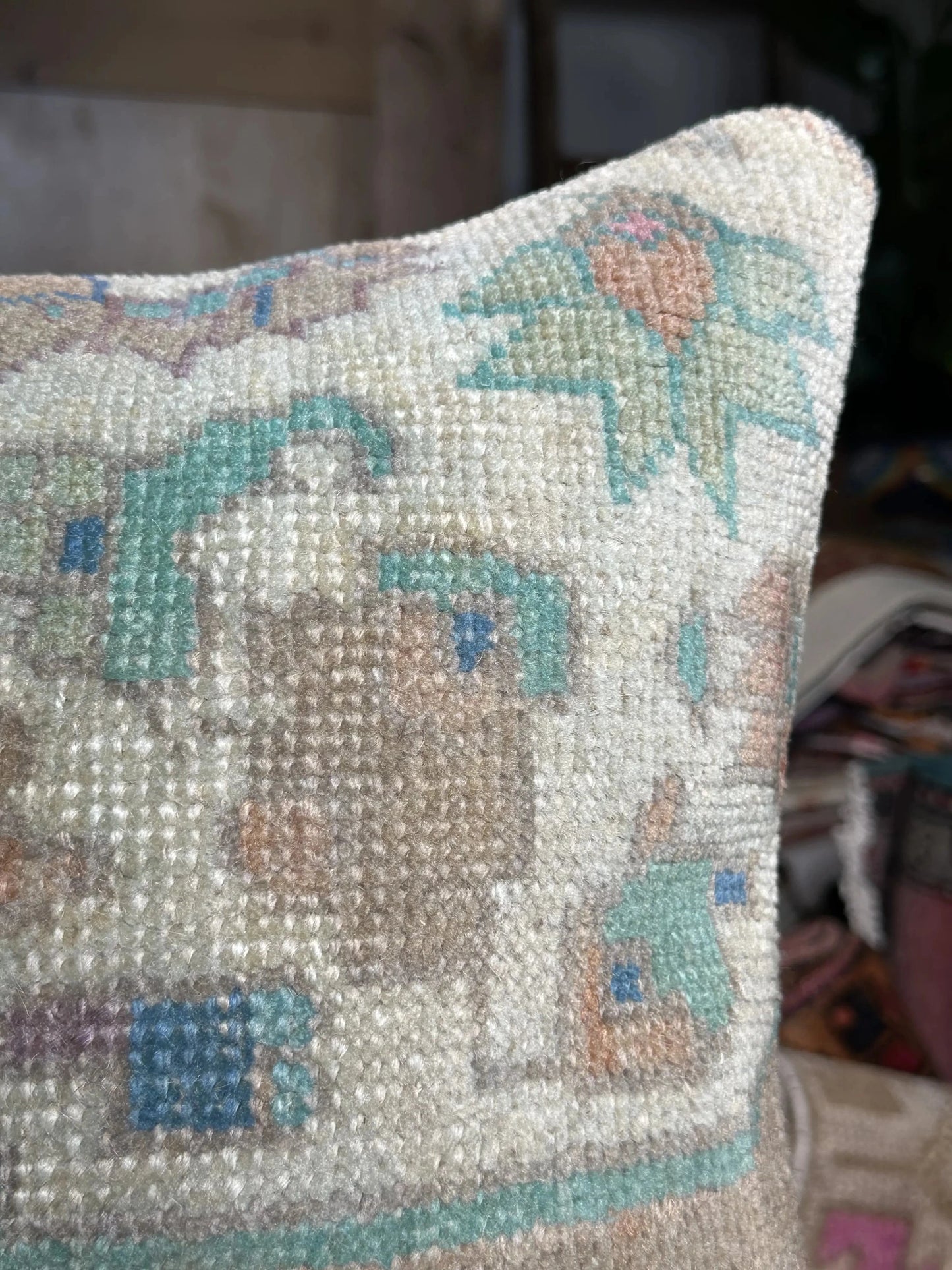 15 by 15 neutral Turkish throw pillow featuring soft pile and muted blue and white tones and a floral pattern upcycled from a Turkish rug