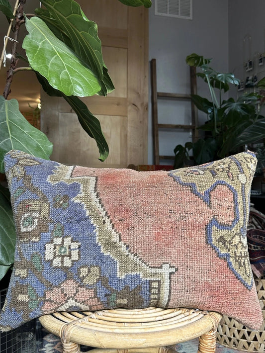16 by 24 Turkish pillow featuring a bright purple and mauve color scheme and geometric pattern with flowers