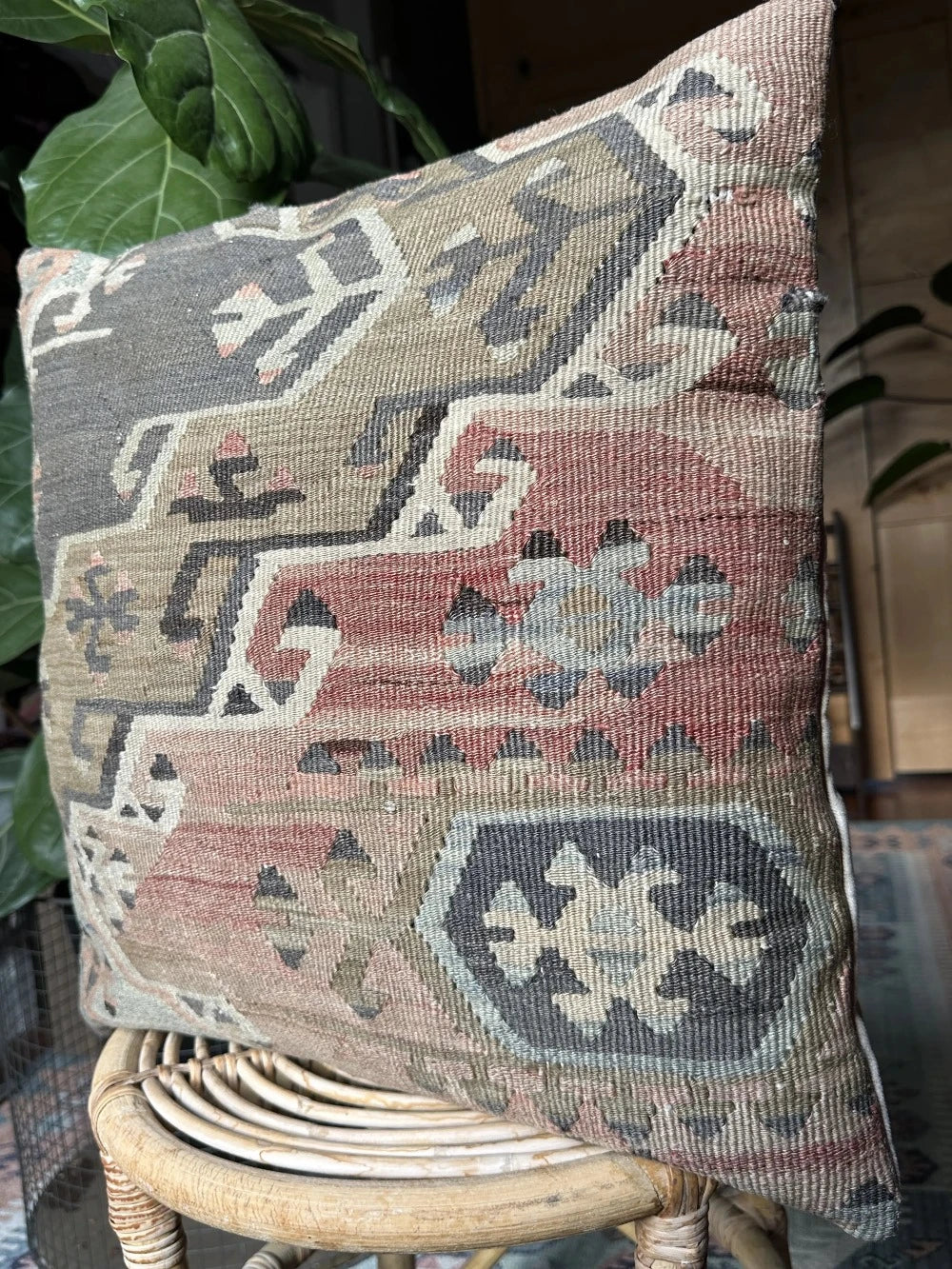 20 by 20 Turkish throw pillow featuring muted tones of blue and pink with geometric patterns upcycled from Turkish rug