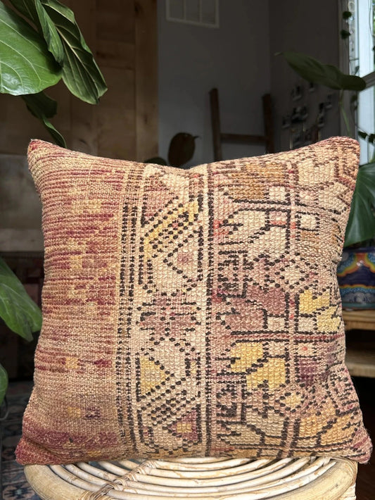 16 by 16 Turkish throw pillow featuring soft pile material and beautiful muted pink and yellow muted tones and a geometric pattern on one side upcycled from a Turkish rug