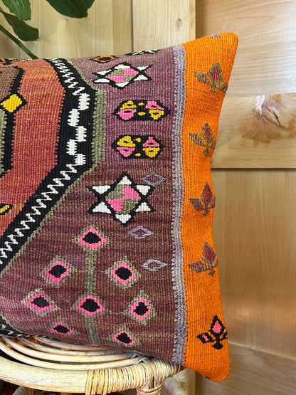Eco-friendly handwoven kilim pillow made from upcycled vintage Turkish rugs. Artisan-crafted with bold tribal motifs in earthy and vibrant tones