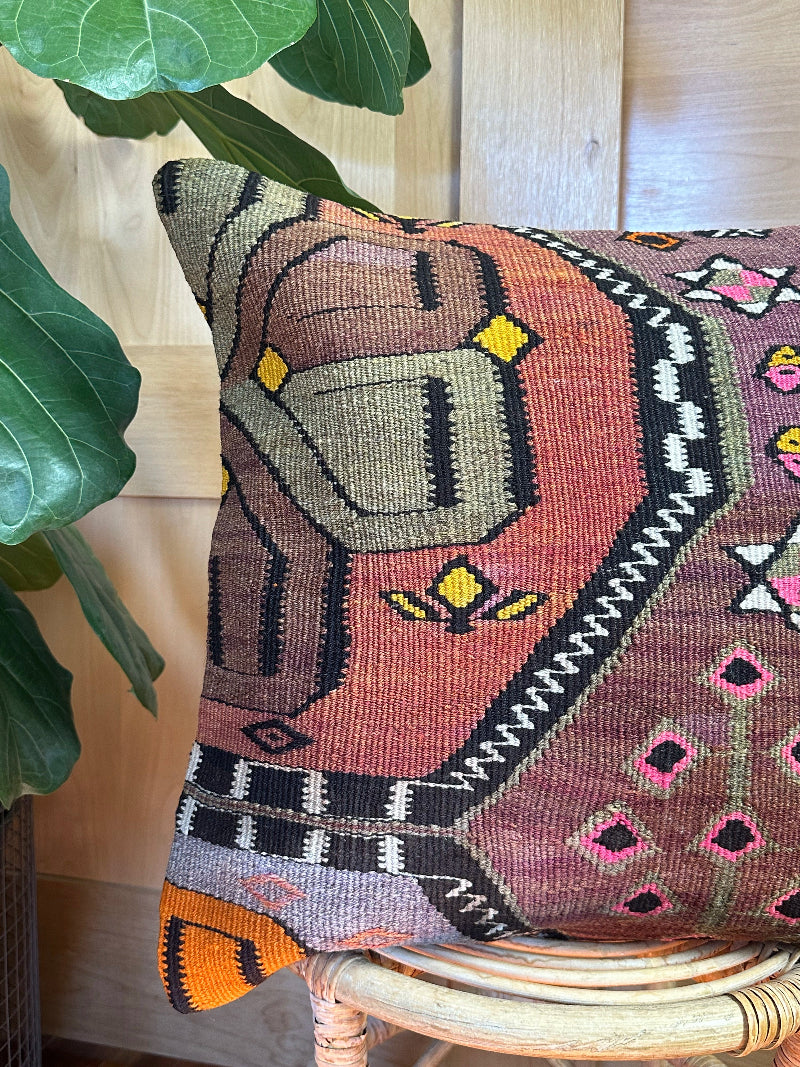 Eco-friendly handwoven kilim pillow made from upcycled vintage Turkish rugs. Artisan-crafted with bold tribal motifs in earthy and vibrant tones