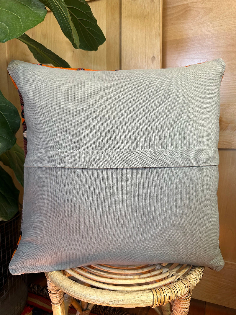 Eco-friendly handwoven kilim pillow made from upcycled vintage Turkish rugs. Artisan-crafted with bold tribal motifs in earthy and vibrant tones