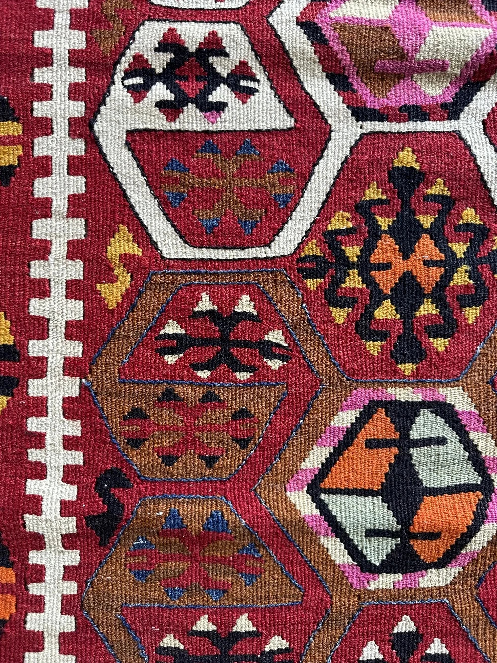 5 by 3 bright red Turkish area rug featuring floral and geometric border with pops of green, yellow, orange, perfect condition