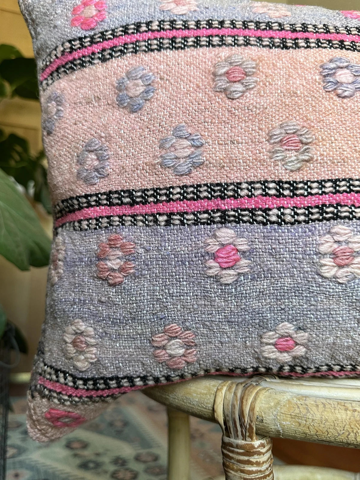 16 by 24 inch handmade Turkish lumbar pillow featuring a pink and purple striped design and embroidered pink flowers throughout