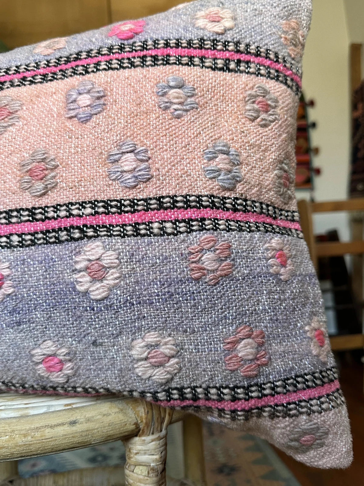 16 by 24 inch handmade Turkish lumbar pillow featuring a pink and purple striped design and embroidered pink flowers throughout