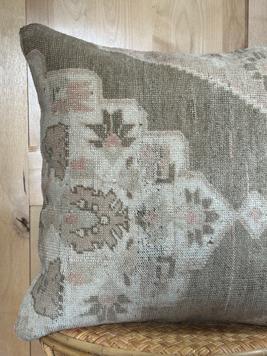 26x26 low-pile pillow made from upcycled Turkish rugs. Artisan-crafted in muted taupe, beige, and soft sage tones.