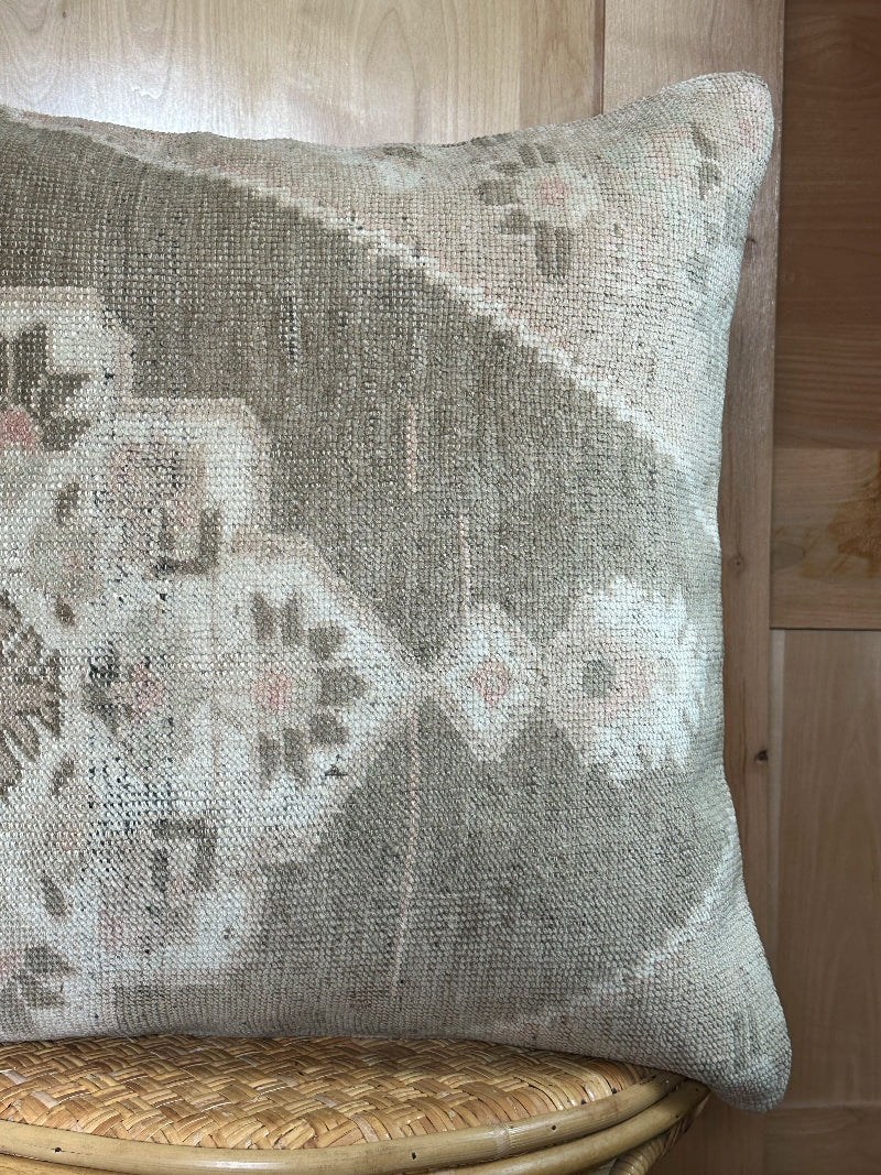 26x26 low-pile pillow made from upcycled Turkish rugs. Artisan-crafted in muted taupe, beige, and soft sage tones.