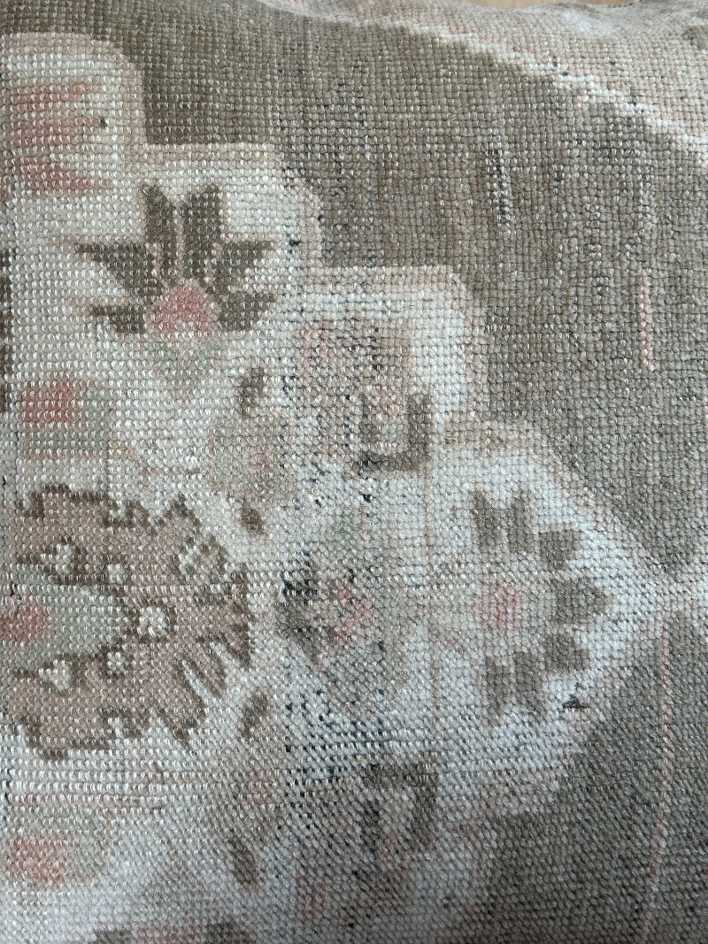 26x26 low-pile pillow made from upcycled Turkish rugs. Artisan-crafted in muted taupe, beige, and soft sage tones.