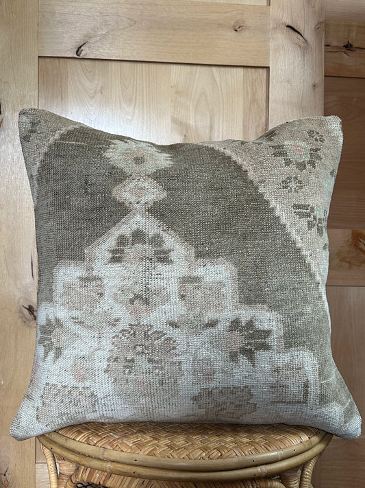 26x26 low-pile pillow made from upcycled Turkish rugs. Artisan-crafted in muted taupe, beige, and soft sage tones.