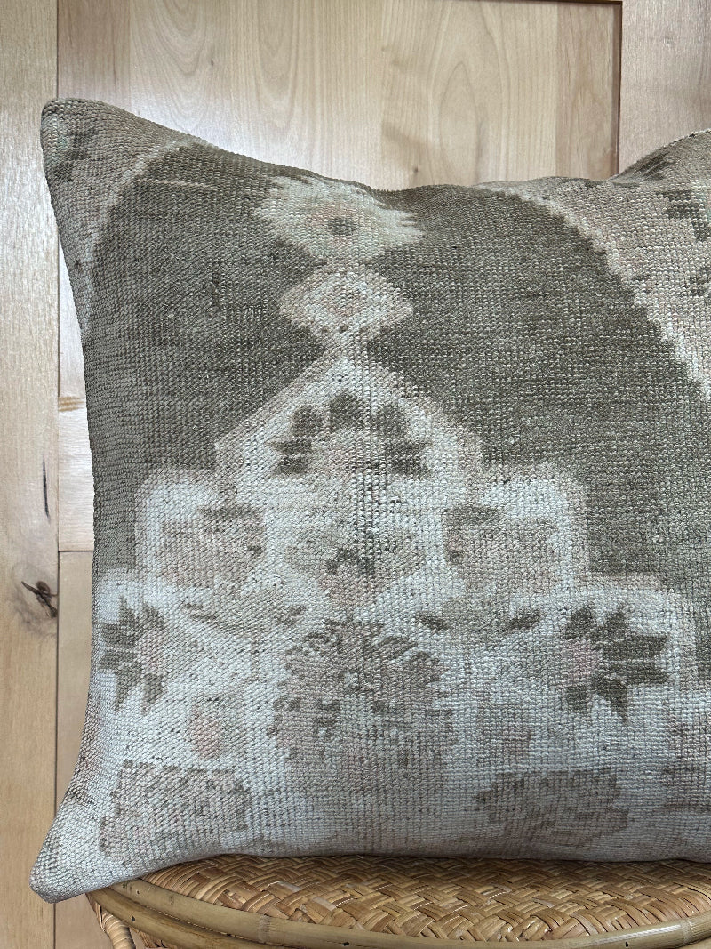 26x26 low-pile pillow made from upcycled Turkish rugs. Artisan-crafted in muted taupe, beige, and soft sage tones.