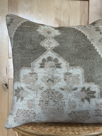 26x26 low-pile pillow made from upcycled Turkish rugs. Artisan-crafted in muted taupe, beige, and soft sage tones.