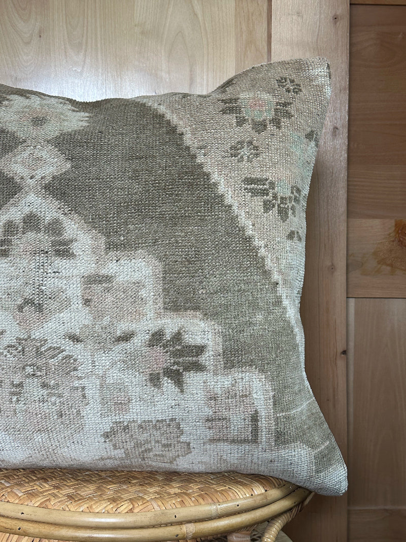 26x26 low-pile pillow made from upcycled Turkish rugs. Artisan-crafted in muted taupe, beige, and soft sage tones.