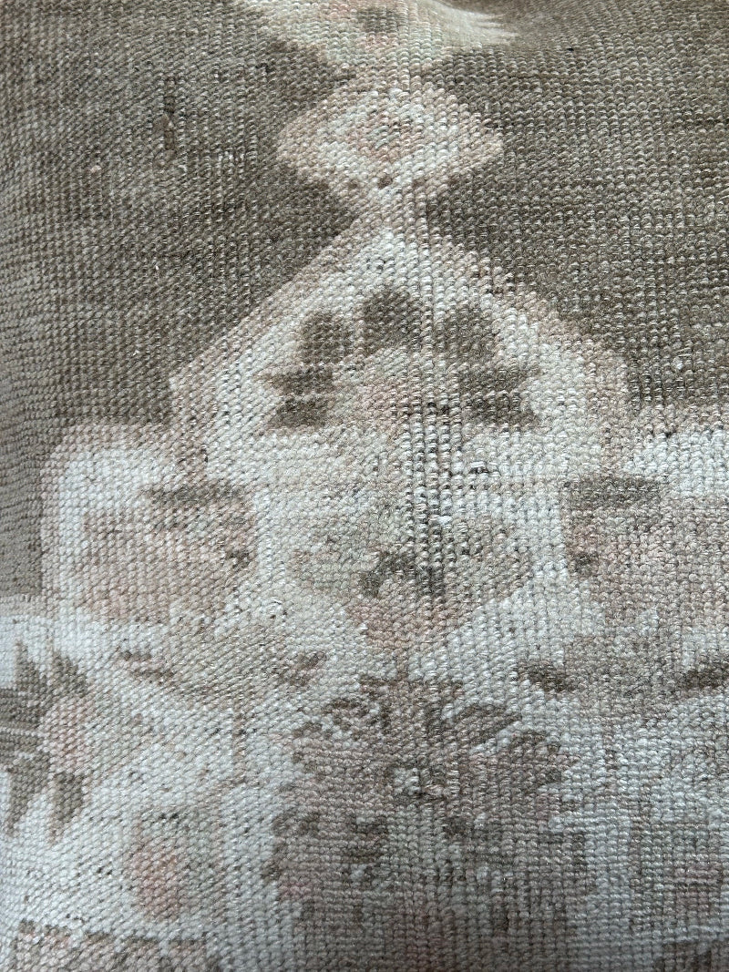 26x26 low-pile pillow made from upcycled Turkish rugs. Artisan-crafted in muted taupe, beige, and soft sage tones.