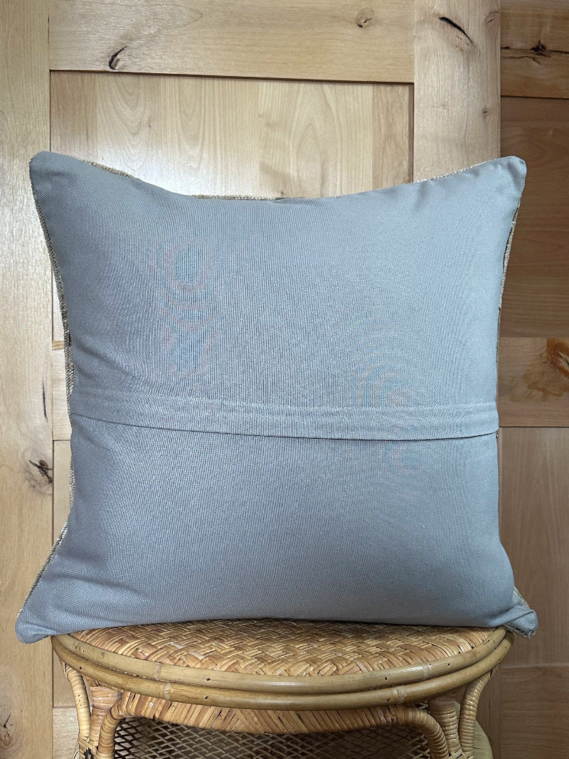26x26 low-pile pillow made from upcycled Turkish rugs. Artisan-crafted in muted taupe, beige, and soft sage tones.
