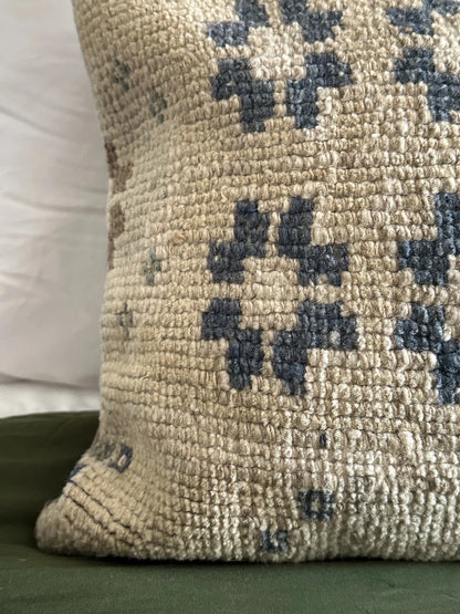 12 by 46 handmade turkish lumbar pillow featuring diamond and floral pattern and pops of navy, cream, sand and light green.