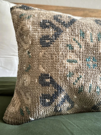 12 by 46 handmade Turkish lumbar pillow featuring a floral and diamond geometric pattern across the face of the pillow