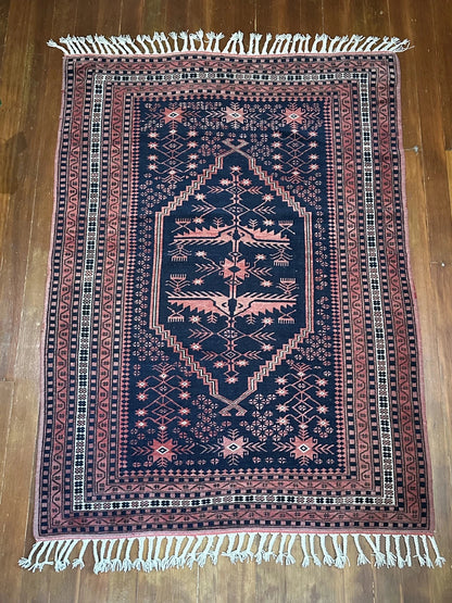 Handmade Turkish rug featuring navy and raspberry hues and 7 different borders with floral and geometric designs