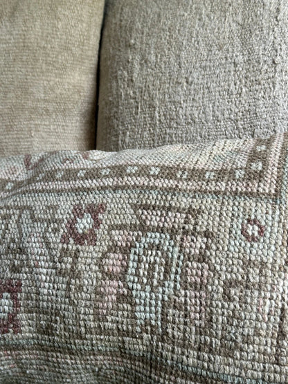 12 by 36 neutral handmade Turkish lumbar pillow featuring brown and sand coloring and a geometric floral pattern