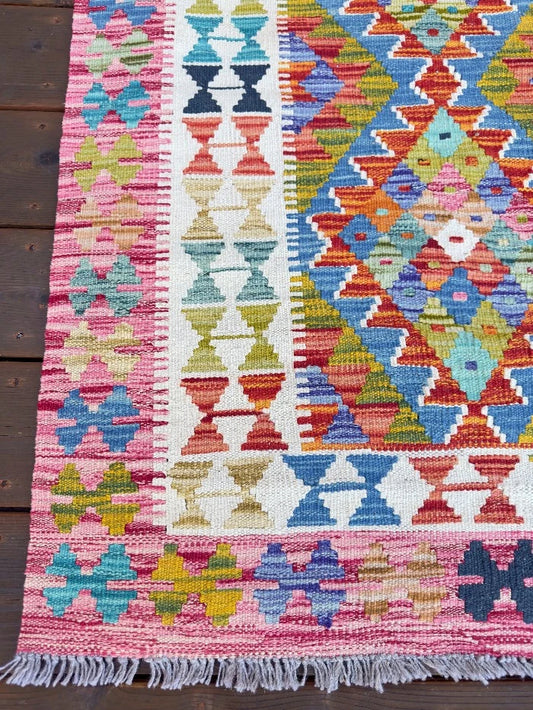 4 by 3 bright pink and colorful Turkish are rug with pink and white border