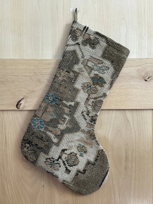 handmade Turkish rug Christmas stocking featuring a neutral floral pattern with hints of baby blue flowers