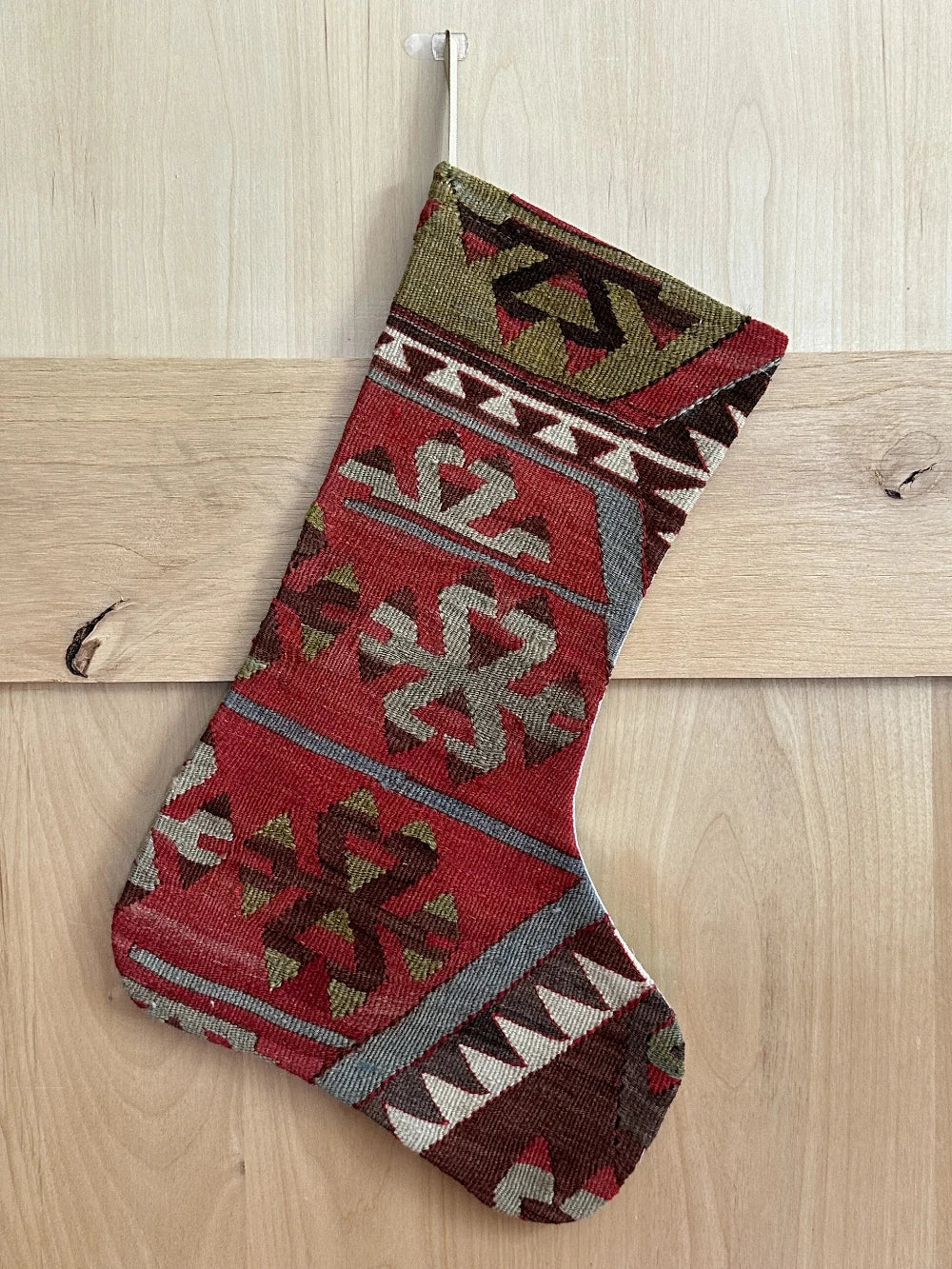 handmade turkish christmas stocking featuring a red body with accents of green, light blue, maroon and white