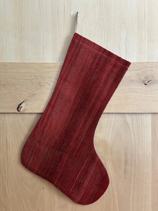 Solid red handmade turkish Christmas stocking featuring a deep fire engine red hue