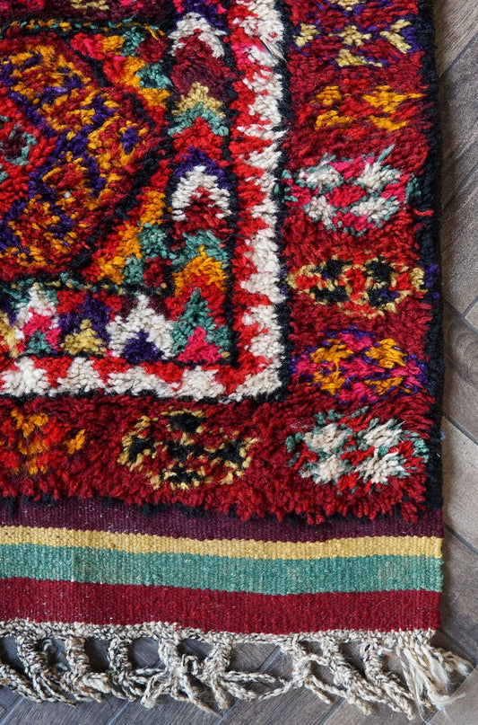 10.5 by 3 foot colorful Turkish runner featuring high pile and multicolored geometric patterns throughout