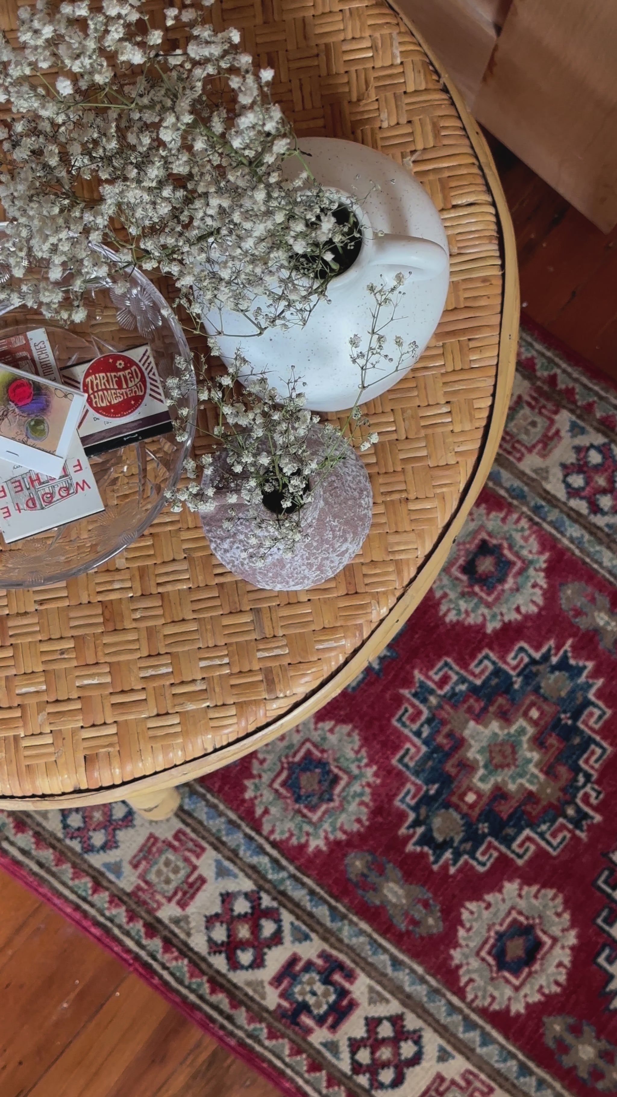 Hand-knotted 2x3 foot mini pile rug featuring a colorful geometric design, large central motif and geometric border - wool material with pops of red, light blue, navy and white. 