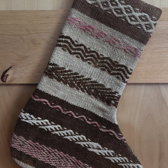 brown and tan striped handmade Turkish Christmas stocking with pink woven stripes throughout