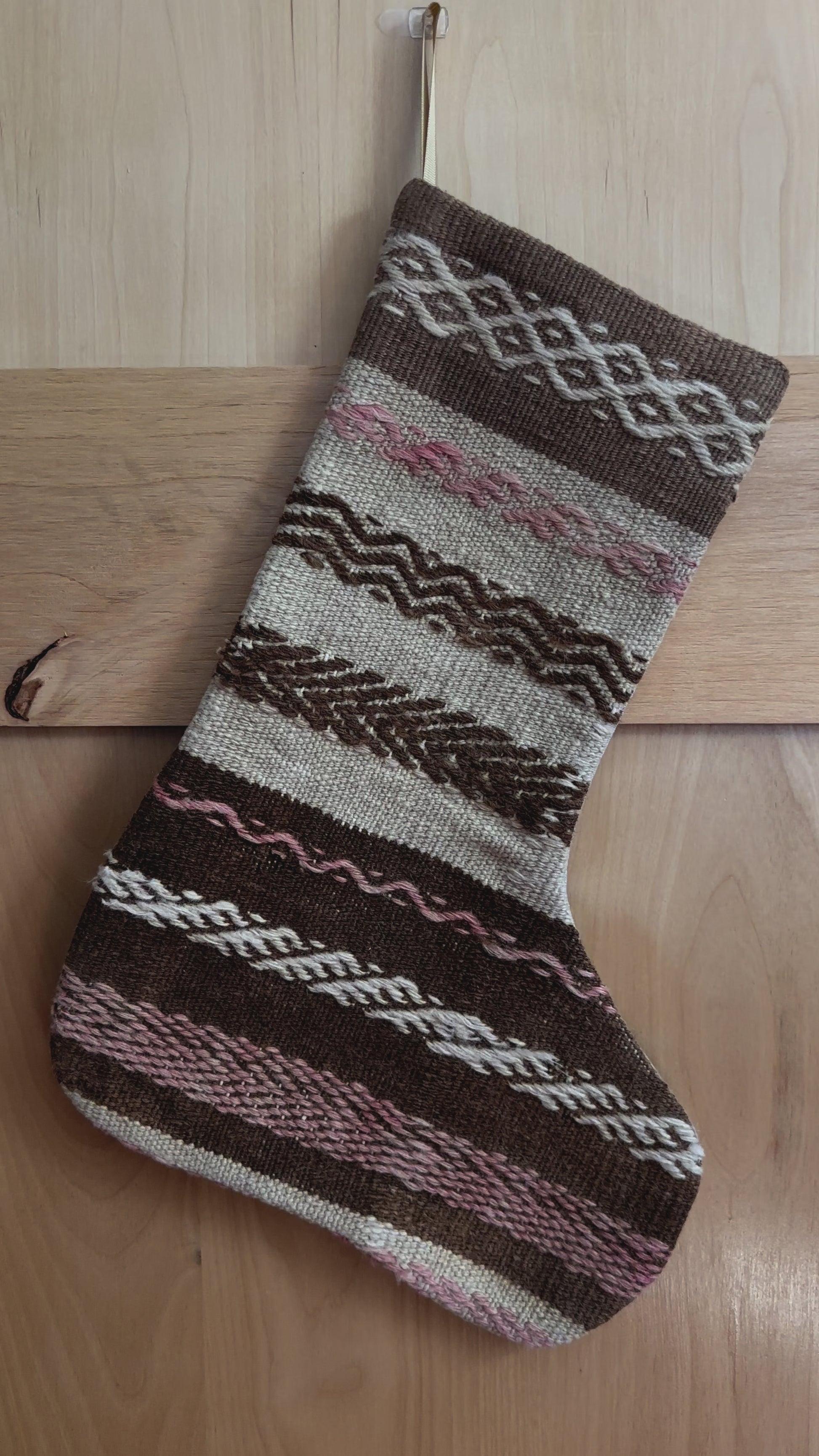 brown and tan striped handmade Turkish Christmas stocking with pink woven stripes throughout