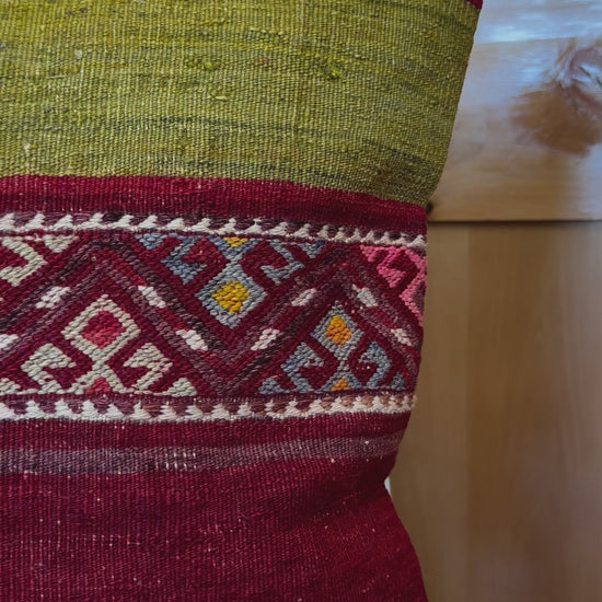 Handwoven red and green Turkish throw pillow, 20x20 inches, wool front with striped design and pops of white and pink, cotton backing—boho home decor.