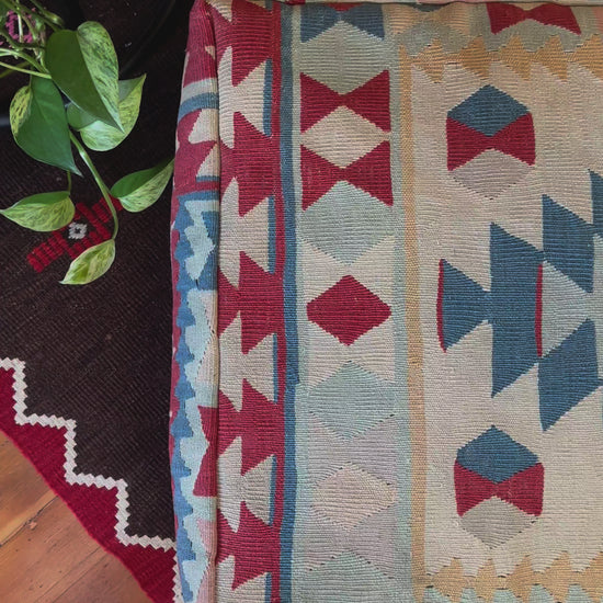 Handmade vintage Turkish rug pouf with blue & neutral tones, up-cycled from authentic wool Kilim rugs. Perfect as a unique bohemian floor cushion, ottoman, or accent seating for living rooms, bedrooms, or cozy spaces. Ethically crafted by artisans in Turkey.