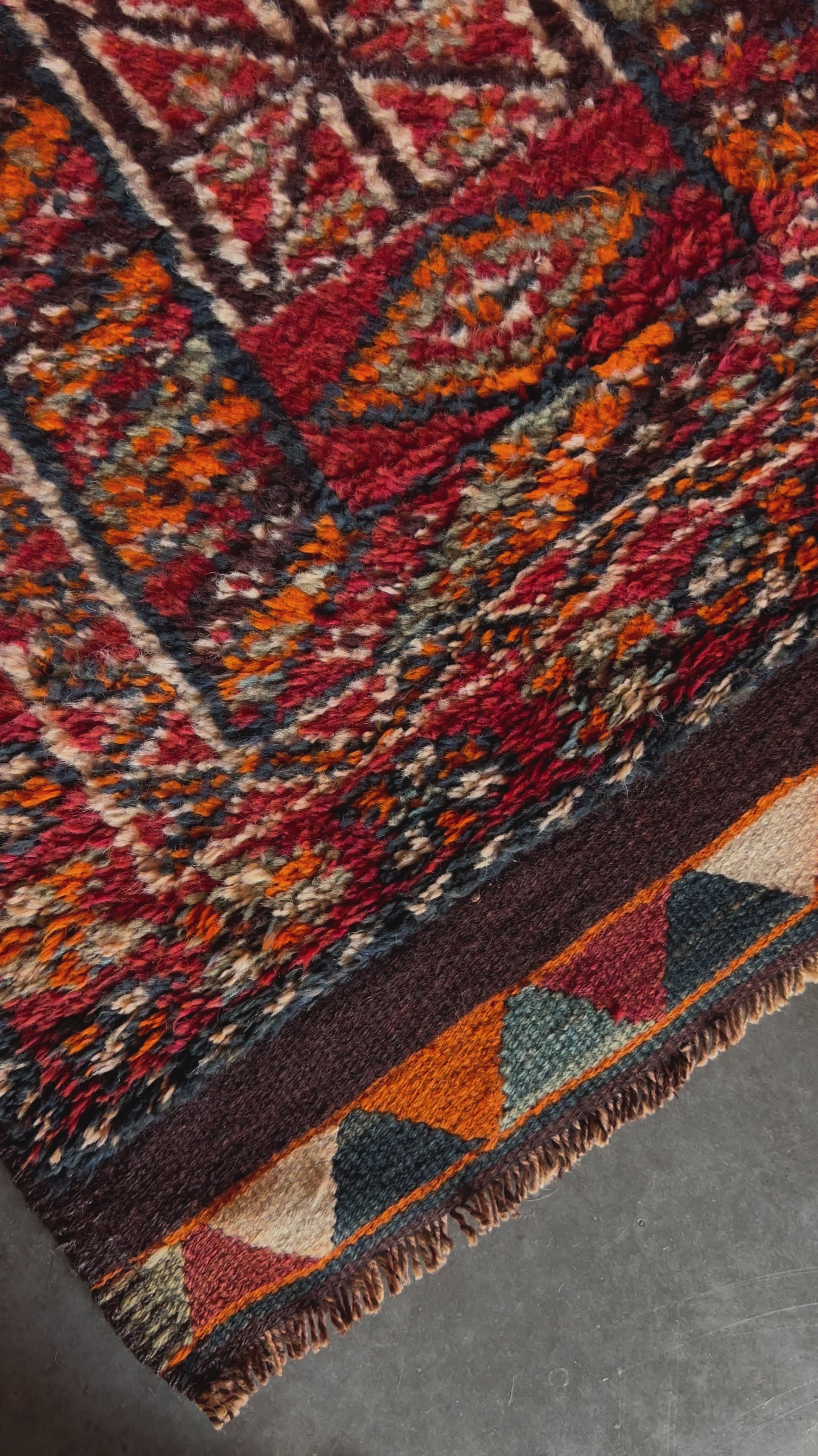 11 foot by 3 foot Turkish high pile Herki runner, featuring a black, red and orange geometric pattern throughout