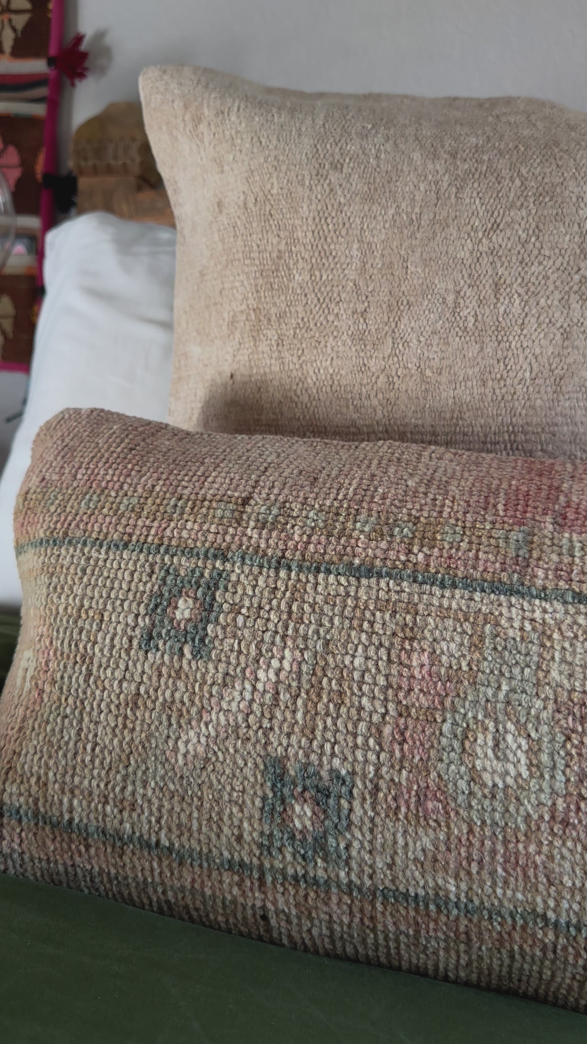 12 by 36 neutral lumbar pillow featuring a floral geometric design with pops of dusty rose and navy blue