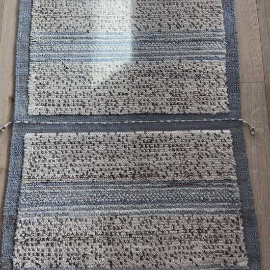 Hand-knotted mini Moroccan rug with a plush high-pile texture. Crafted from 100% wool, featuring a minimalist yet timeless design, perfect for modern, bohemian, or eclectic home décor.