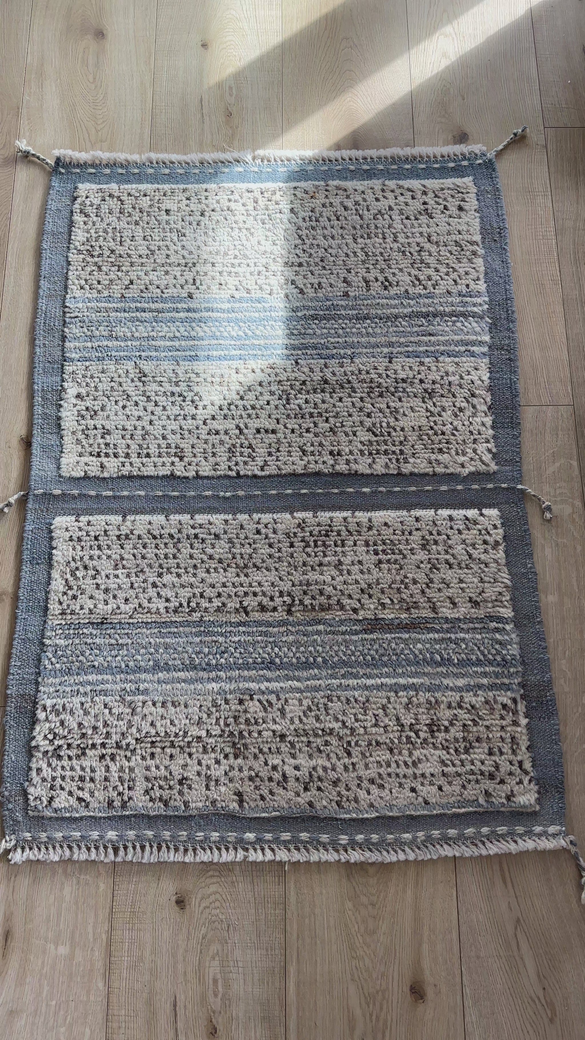 Hand-knotted mini Moroccan rug with a plush high-pile texture. Crafted from 100% wool, featuring a minimalist yet timeless design, perfect for modern, bohemian, or eclectic home décor.