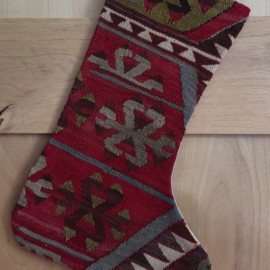 handmade turkish christmas stocking featuring a red body with accents of green, light blue, maroon and white