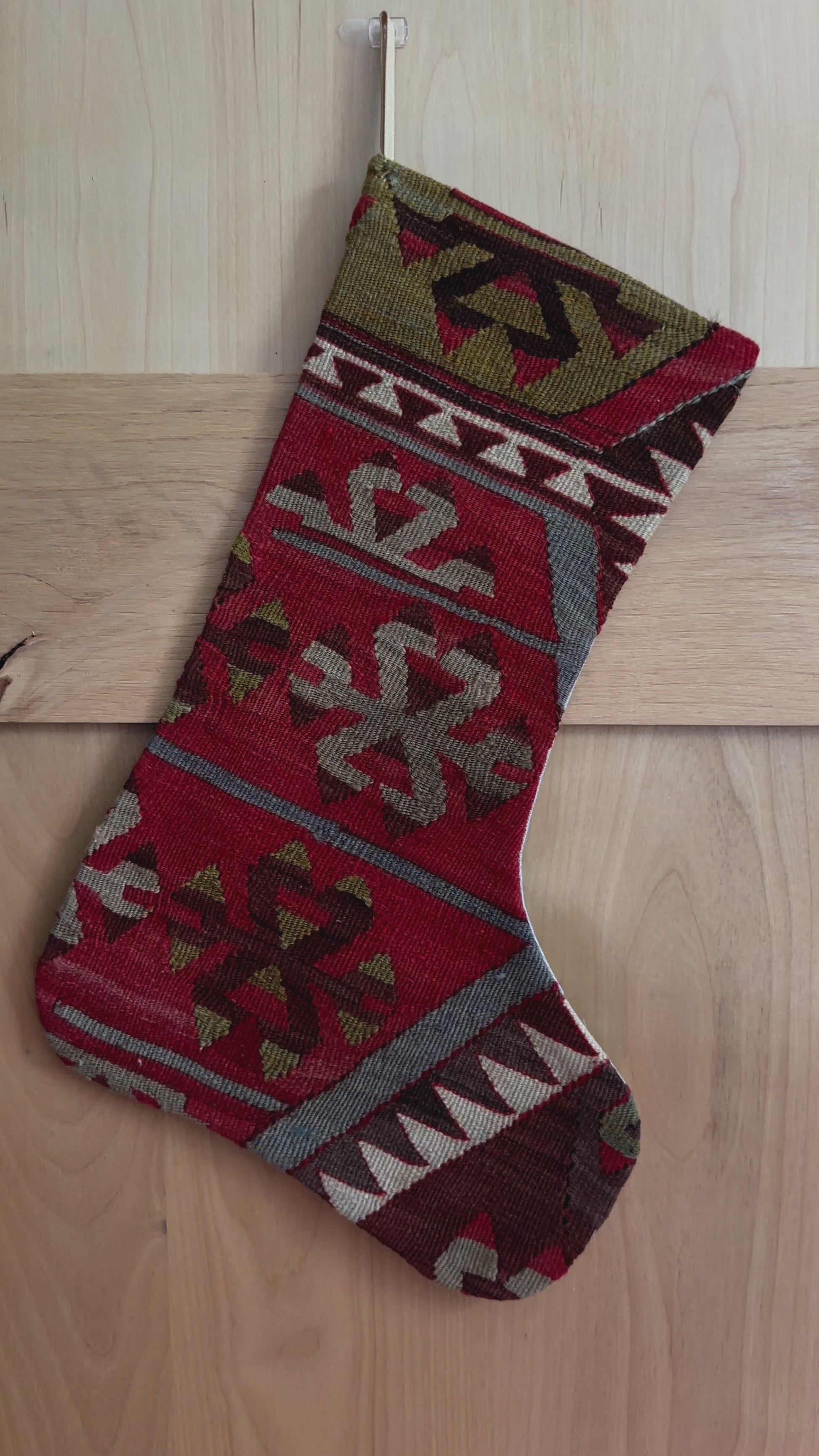 handmade turkish christmas stocking featuring a red body with accents of green, light blue, maroon and white