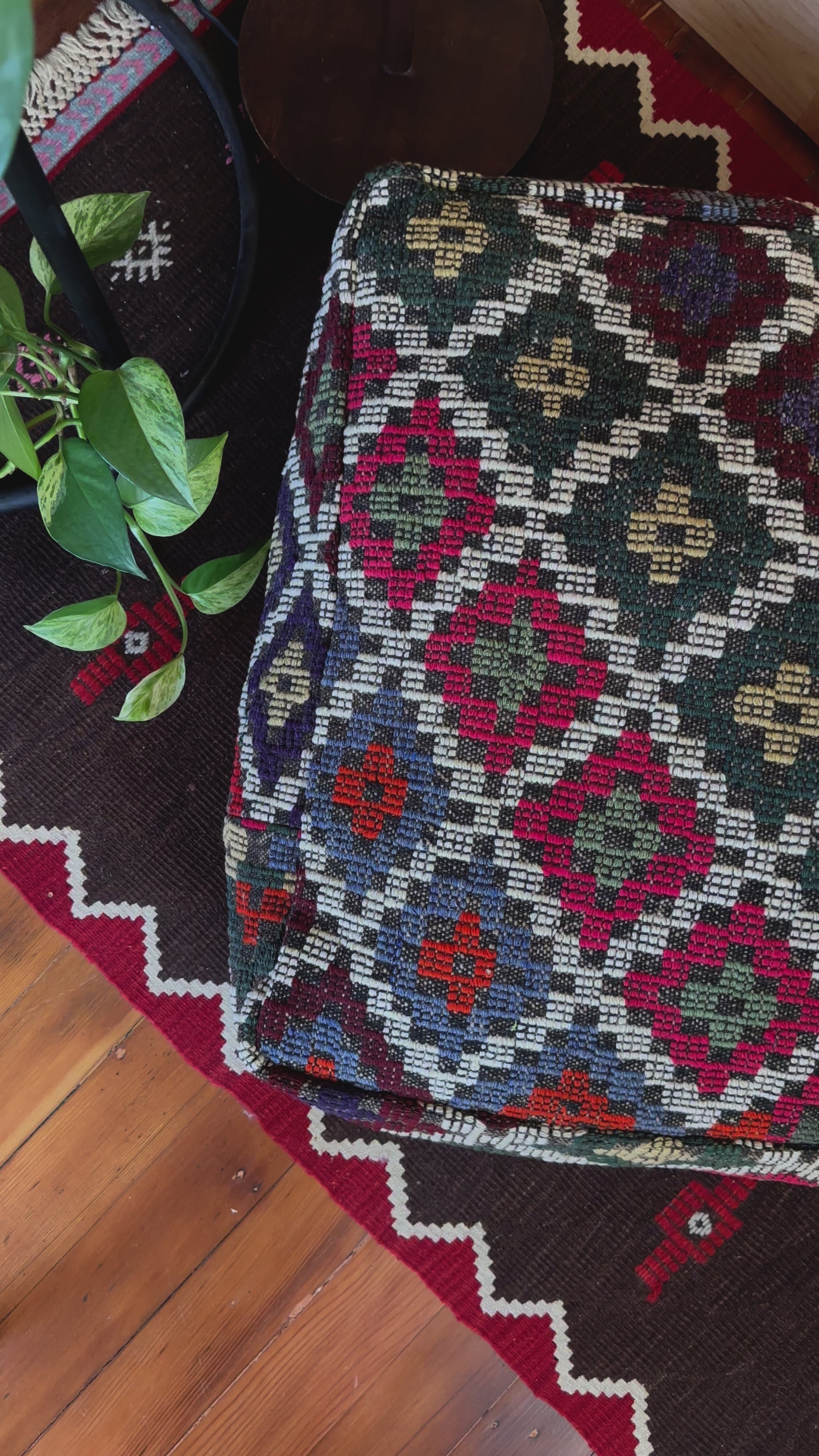 Handmade vintage Turkish rug pouf with colorful tones, up-cycled from authentic wool Kilim rugs. Perfect as a unique bohemian floor cushion, ottoman, or accent seating for living rooms, bedrooms, or cozy spaces. Ethically crafted by artisans in Turkey.