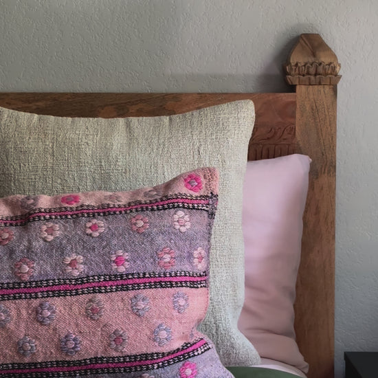 16 by 24 inch handmade Turkish lumbar pillow featuring a pink and purple striped design and embroidered pink flowers throughout