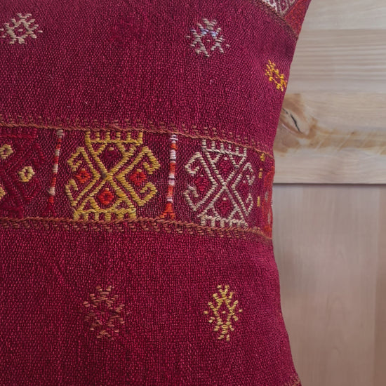 Handwoven red embroidered Turkish throw pillow, 26x26 inches, wool front with geometric design and pops of yellow and white, cotton backing—boho home decor.